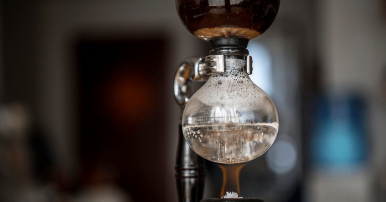 siphon coffee maker brewing coffee