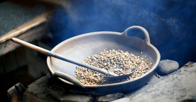 roasting coffee in a pan