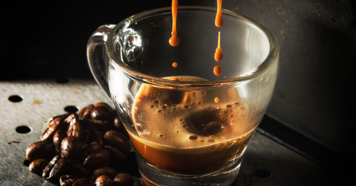 espresso in a glass cup and coffee beens