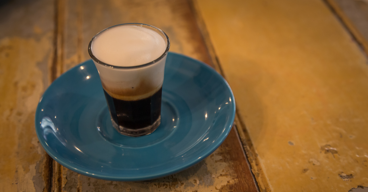 macchiato coffee on the rustic table