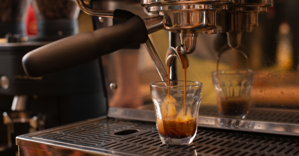 espresso machine pouring coffee into a glass