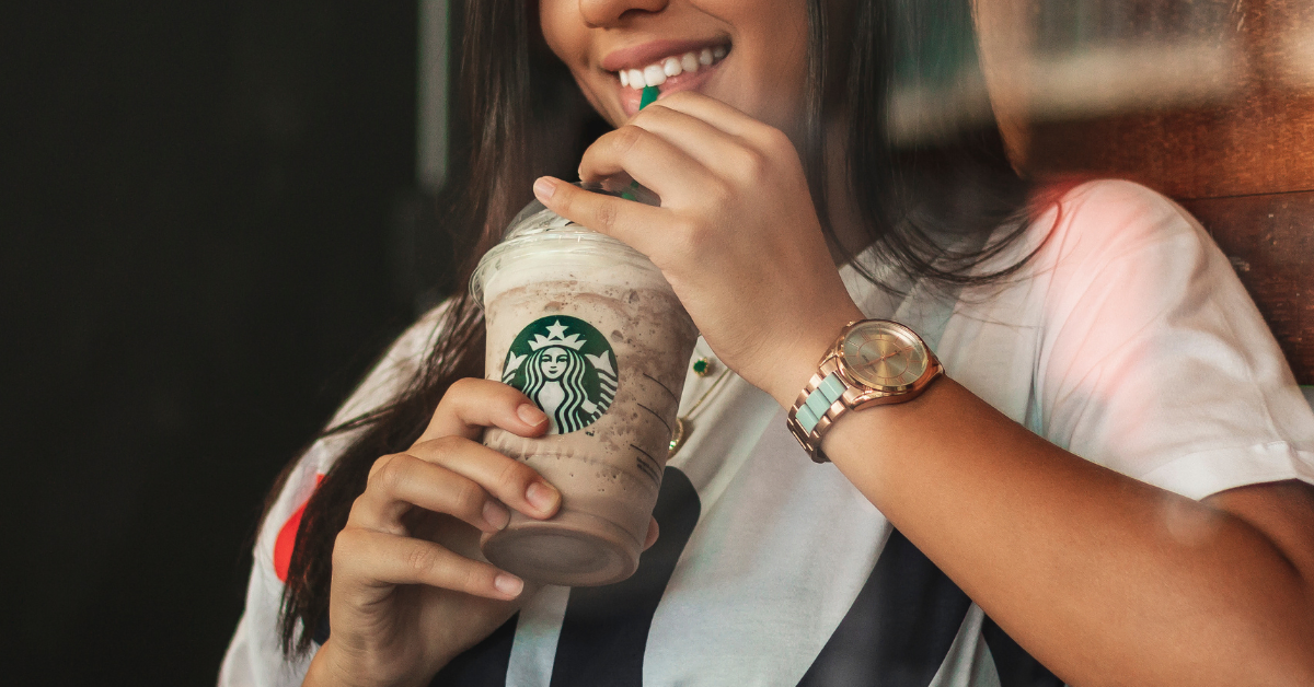 woman drinking starbucks frappuccino