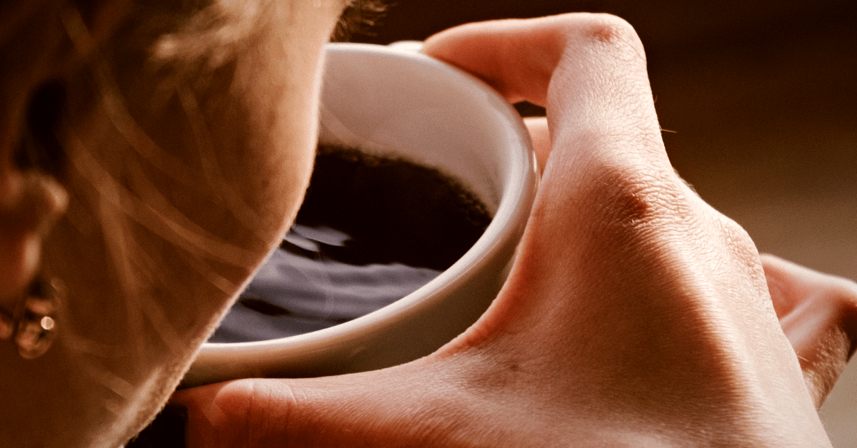 a woman drinking coffee