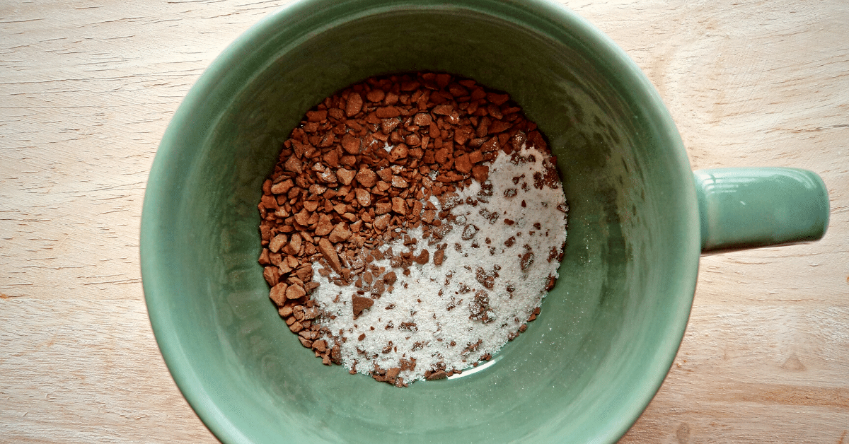 instant coffee and powder creamer in a cup