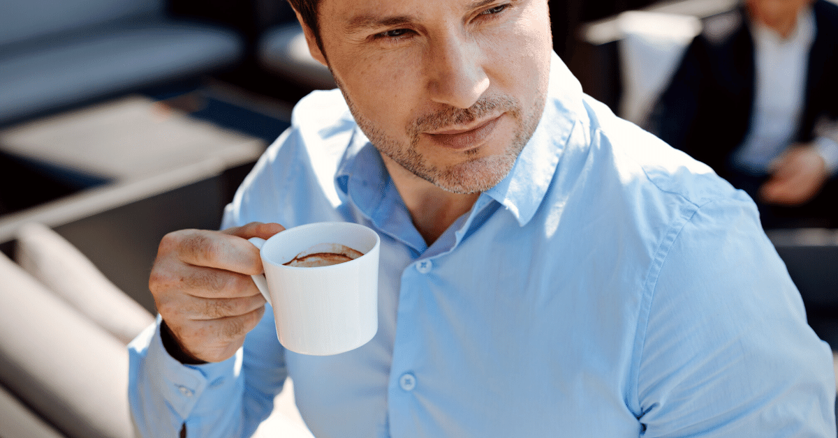 man drinking espresso