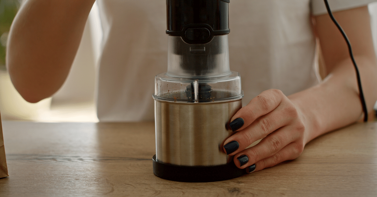 person grinding coffee beans