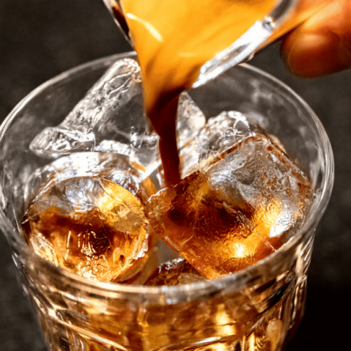 pouring coffee over ice