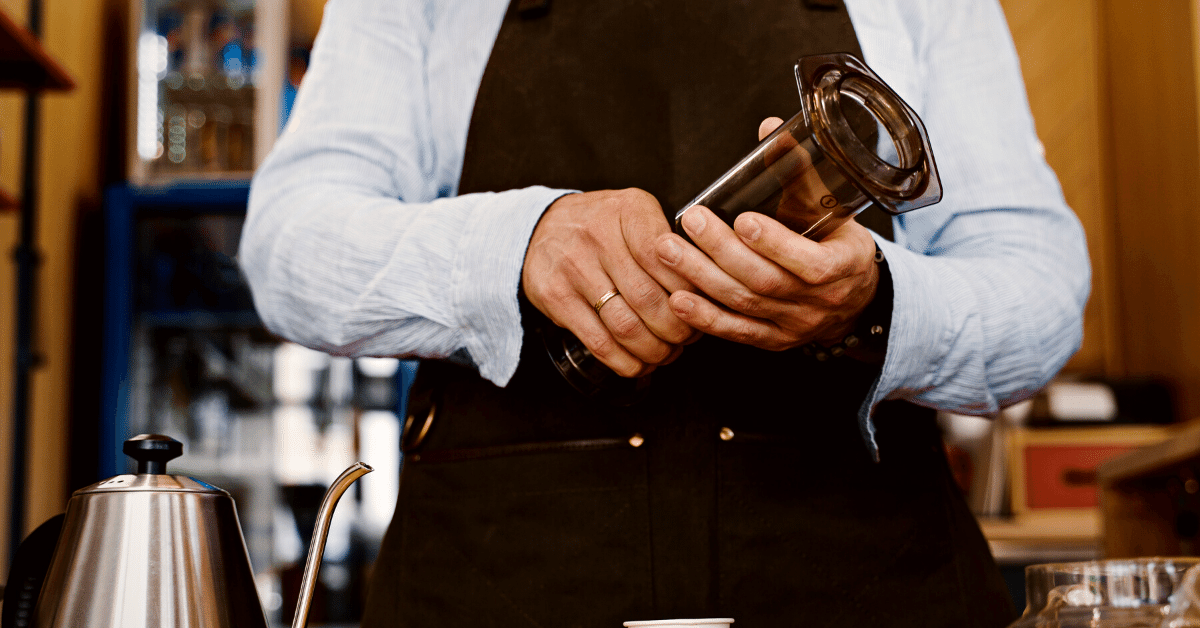 man holding aeropress