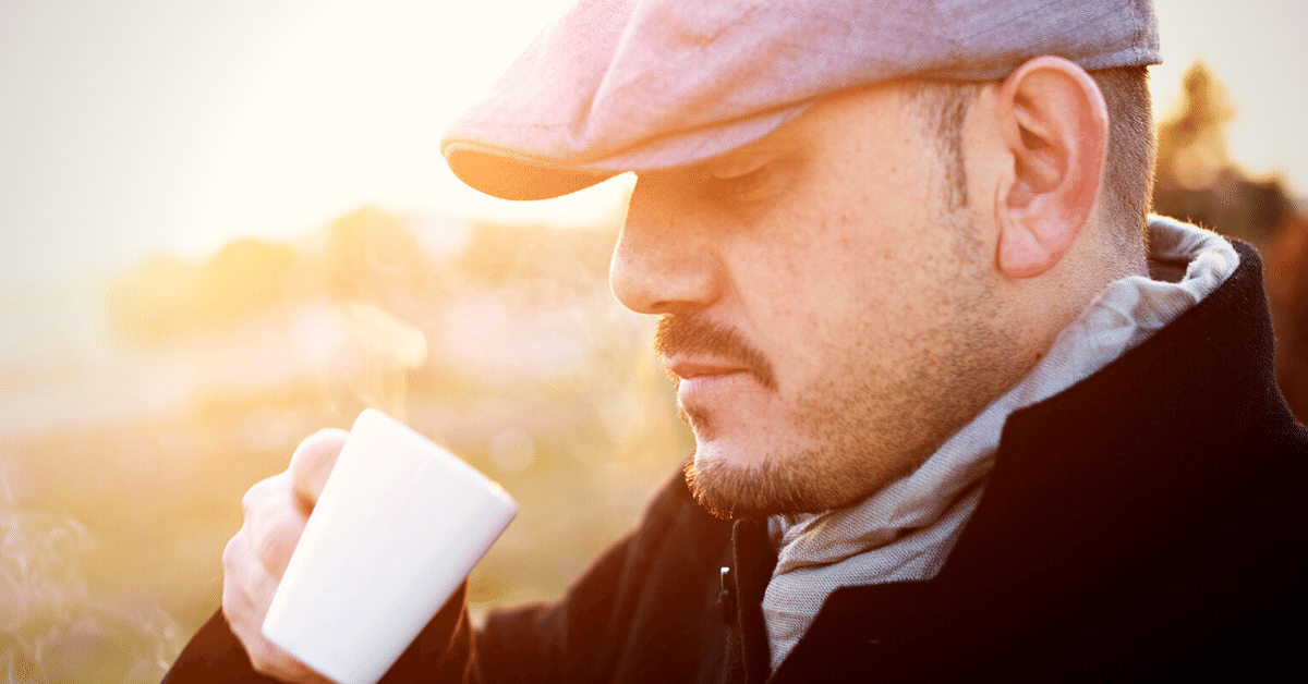 man drinking espresso