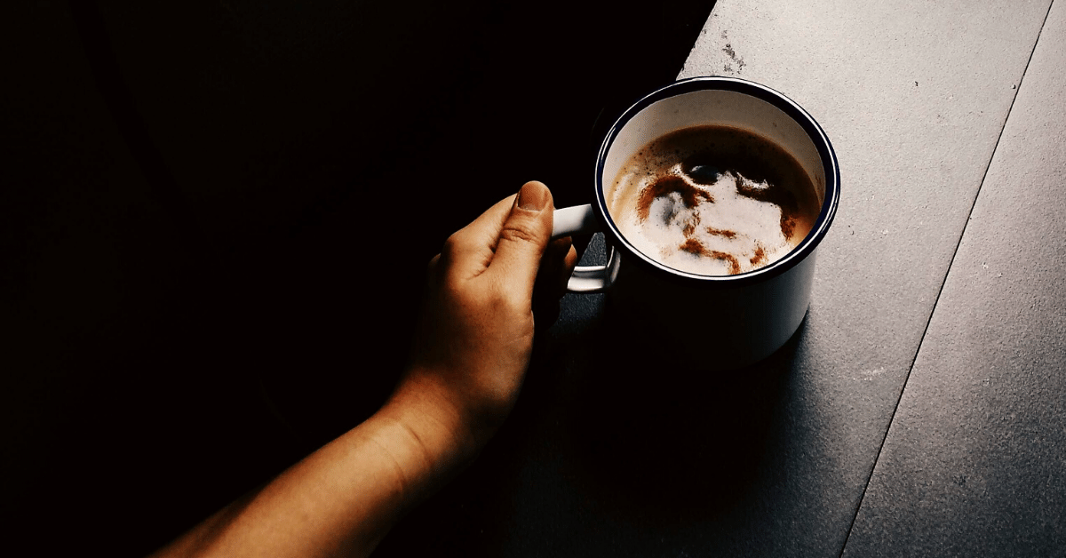 person holding cup of coffee