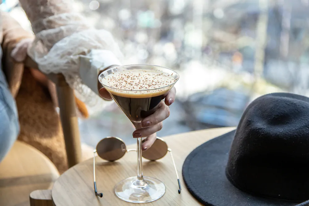 woman drinking espresso martini